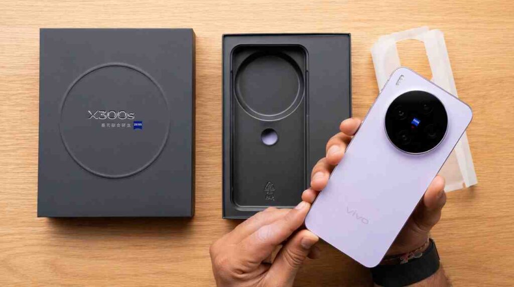 Vivo X300s smartphone in purple color during unboxing showing premium design, circular camera module, and packaging contents